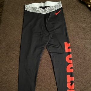 Black Nike just do it leggings coral red/orange on side